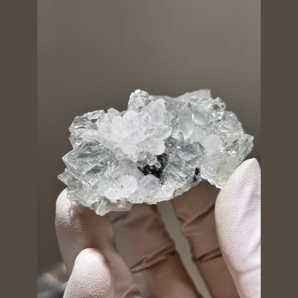 Clear stepped fluorite with quartz and calcite from Zhejiang — detail view