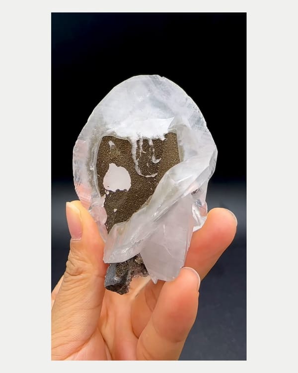 Complete front view of calcite with pyrite and fluorite