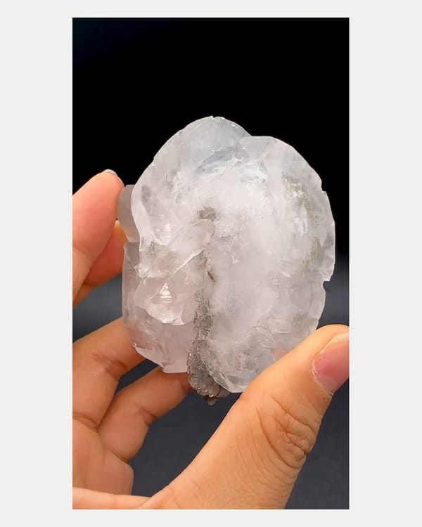 Complete left oblique view of calcite with pyrite and fluorite
