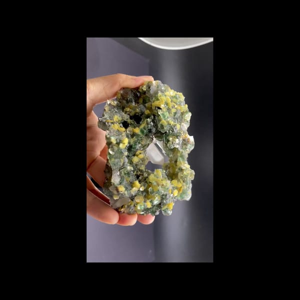 Green fluorite geode with clear quartz and mica from Namibia — detail view