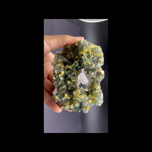 Green fluorite geode with clear quartz and mica from Namibia — detail view