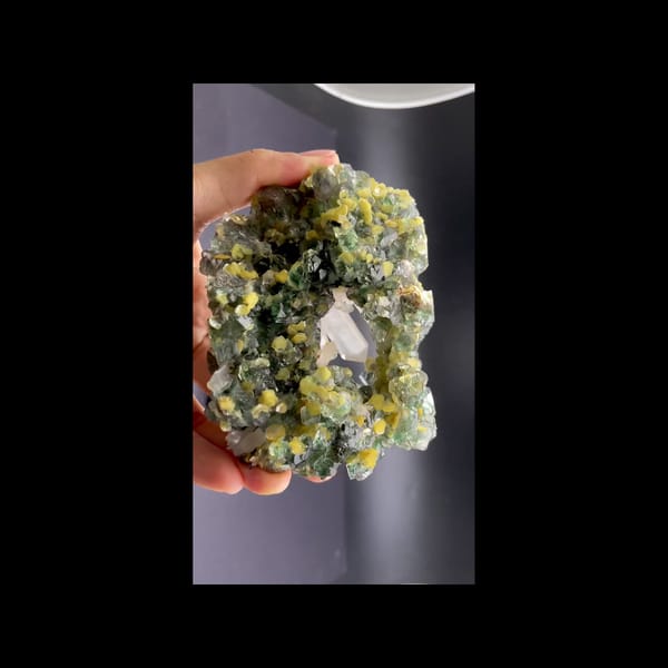 Green fluorite geode with clear quartz and mica from Namibia — detail view