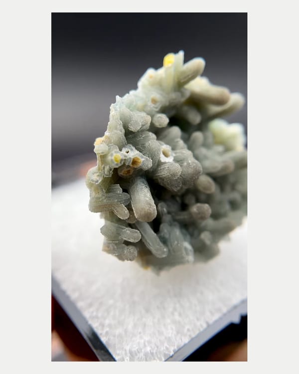 Complete left oblique view of pale blue-green plumbogummite cluster