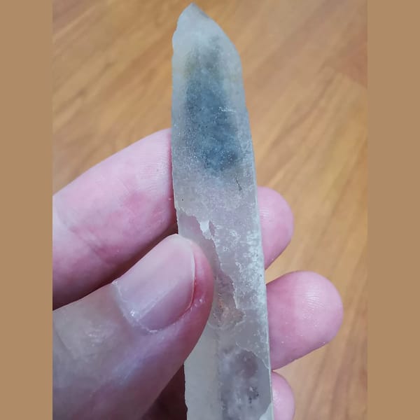 Quartz with grey-green included tip — complete view