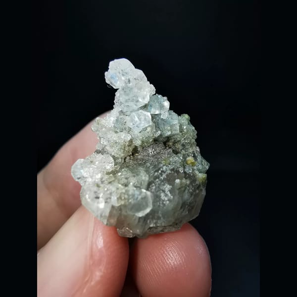 Sparkling apophyllite over yellow-green garnet — detail view
