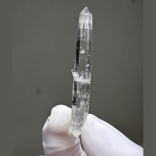 Slender spirit quartz needle from Yunnan — detail view