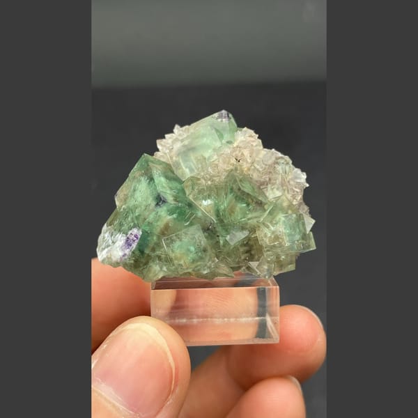 Glassy transparent green fluorite cluster from Hebei — complete view