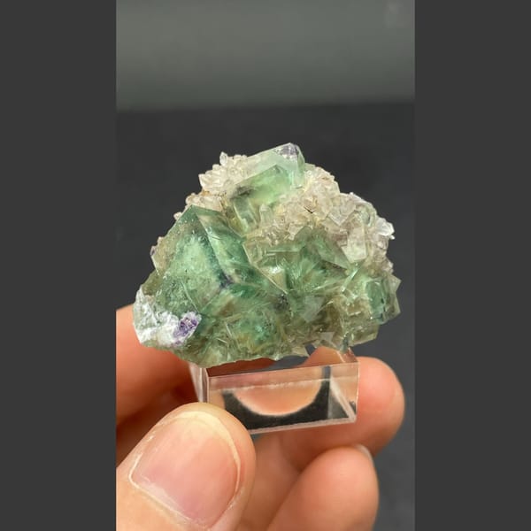 Glassy transparent green fluorite cluster from Hebei — alternate view