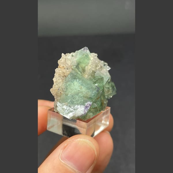 Glassy transparent green fluorite cluster from Hebei — detail view
