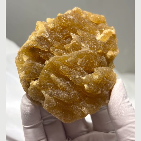 Yellow fluorite with cut base — complete view