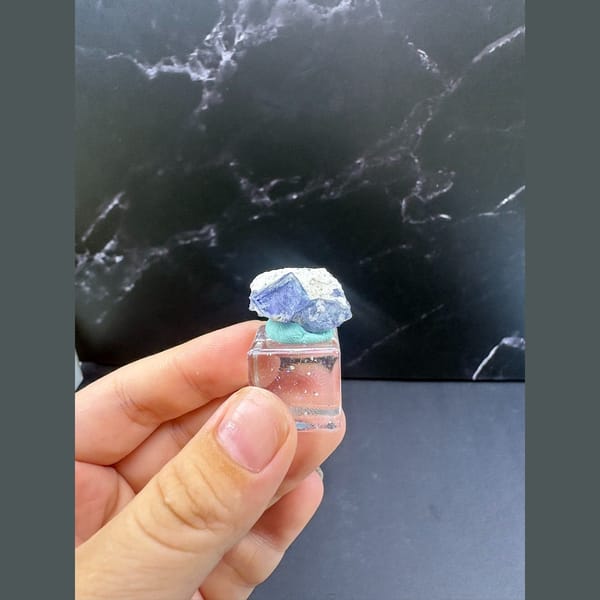 Blue-violet fluorite wrapped in white dolomite from Yaogangxian — detail view