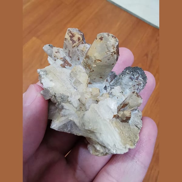 Floater calcite cluster with a quartz crystal — complete view
