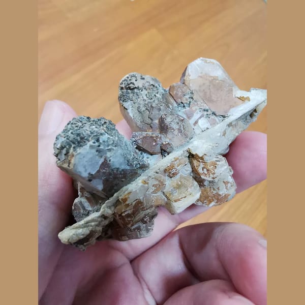 Floater calcite cluster with a quartz crystal — alternate view