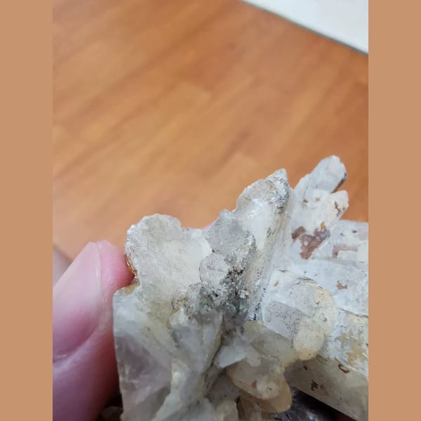Floater calcite cluster with a quartz crystal — alternate view