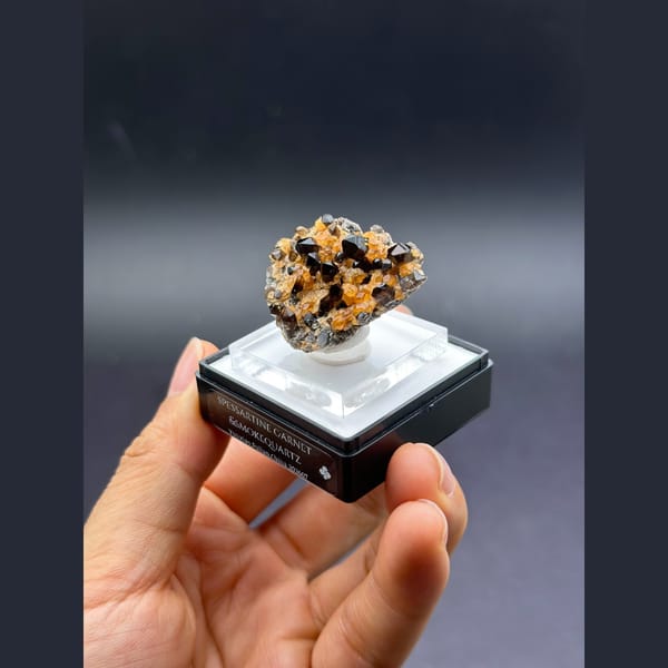 Smoky quartz with orange spessartine garnet from Tongbei, Fujian — alternate view