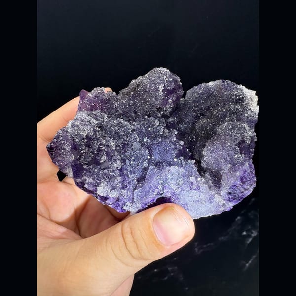 Purple fluorite cluster with a sparkling sugary surface — complete view