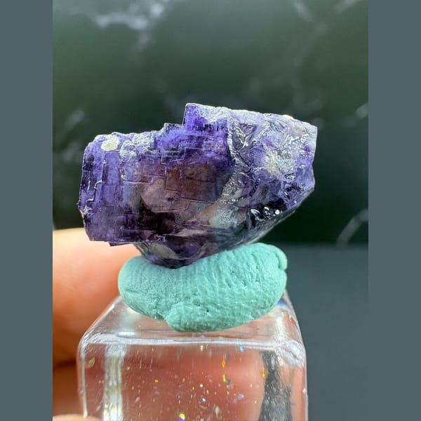 Small rich purple fluorite crystal from Yaogangxian — complete view