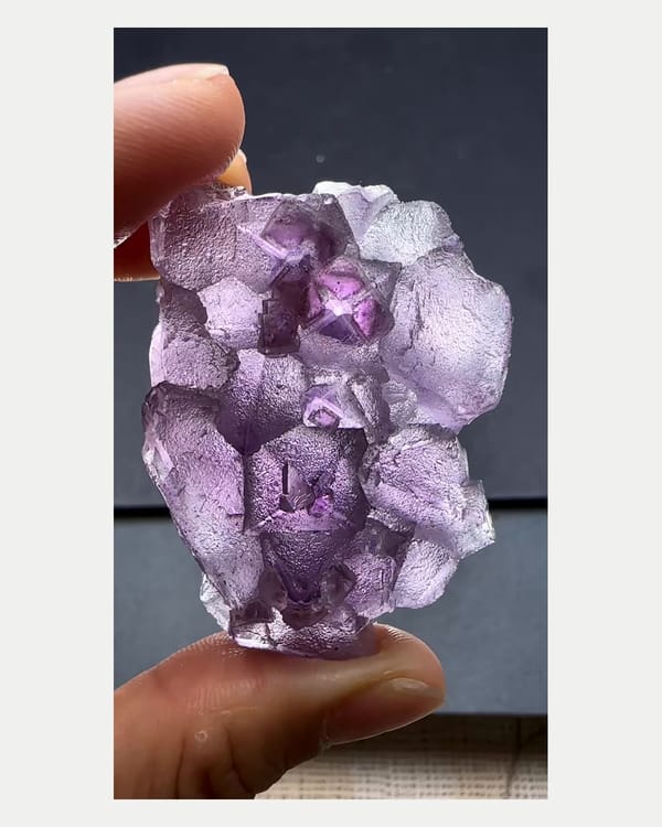 Complete front view of etched purple fluorite crystal