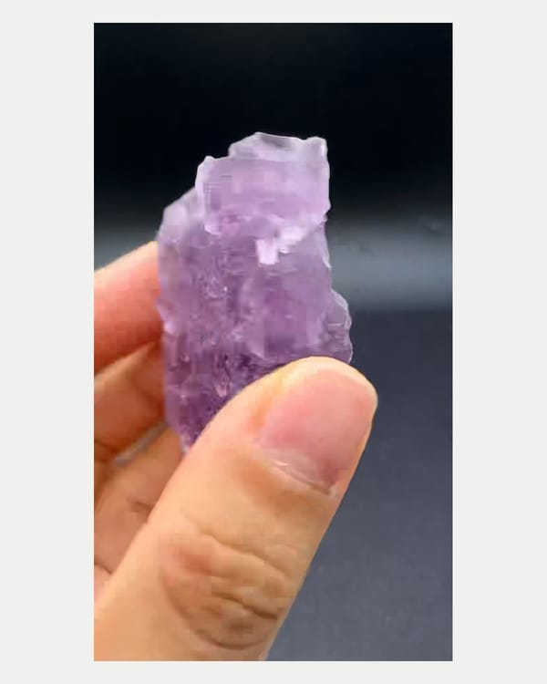 Complete right oblique view of etched purple fluorite crystal