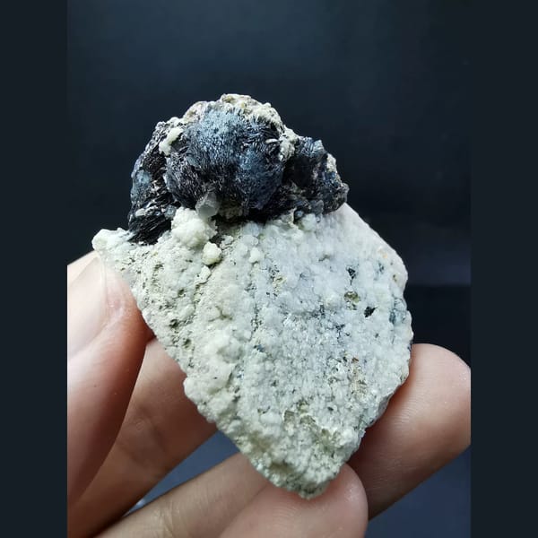 Specular hematite balls with large calcite crystals — complete view