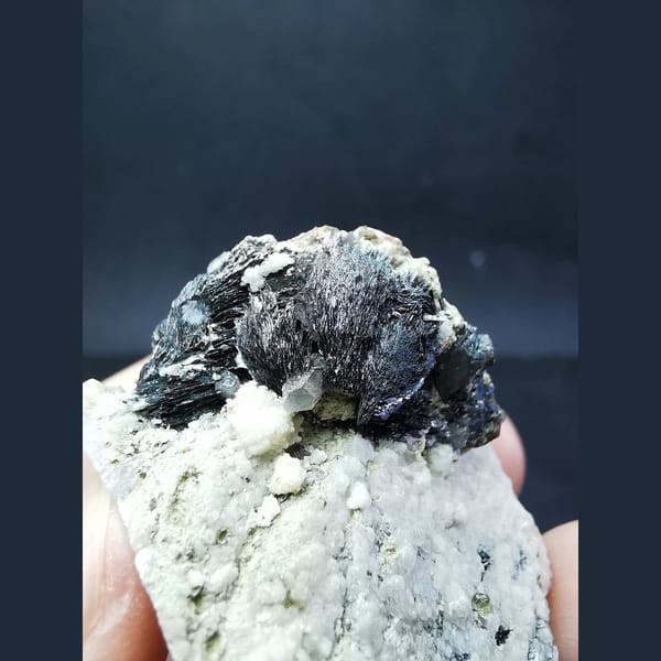 Specular hematite balls with large calcite crystals — alternate view