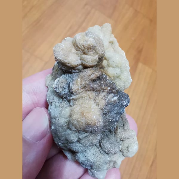 Quartz and hematite coated in calcite — alternate view