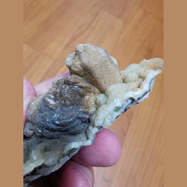 Quartz and hematite coated in calcite — alternate view