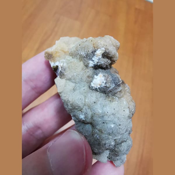 Quartz and hematite coated in calcite — detail view