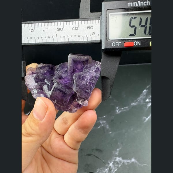 Lavender fluorite cubes with purple inner phantoms from Henan — detail view