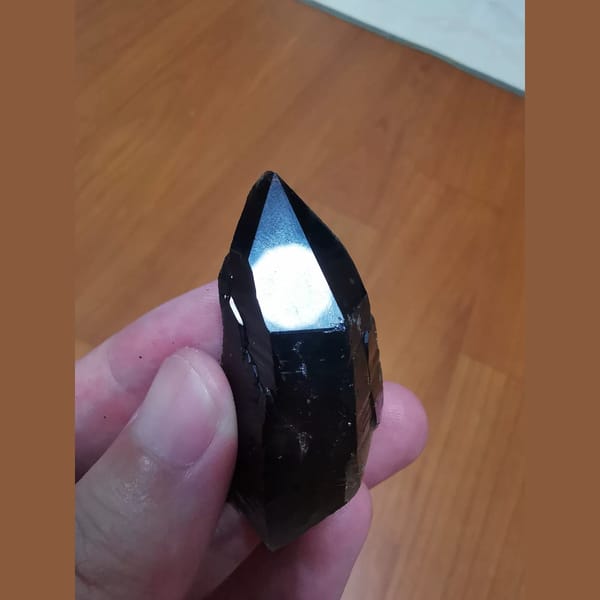 Mirror-lustered black quartz from Inner Mongolia — complete view