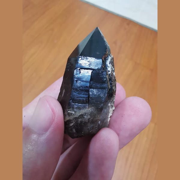 Mirror-lustered black quartz from Inner Mongolia — detail view