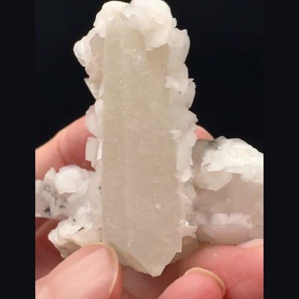 Sparkly white quartz with pale pink petal calcite from Inner Mongolia — detail view
