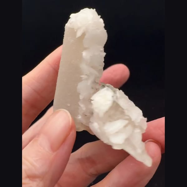 Sparkly white quartz with pale pink petal calcite from Inner Mongolia — detail view