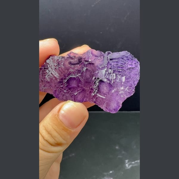 Stepped cluster of deep purple fluorite cubes from Henan — detail view