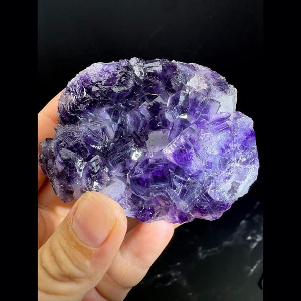 Purple and clear fluorite cluster with sparkling druse — alternate view