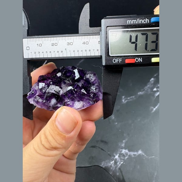 Glassy deep purple fluorite crystal group from Henan — detail view