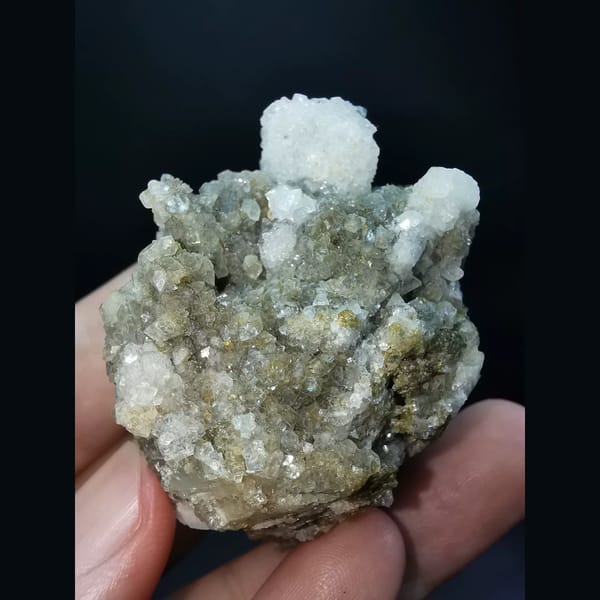 Small garnets and calcite coated by apophyllite — detail view