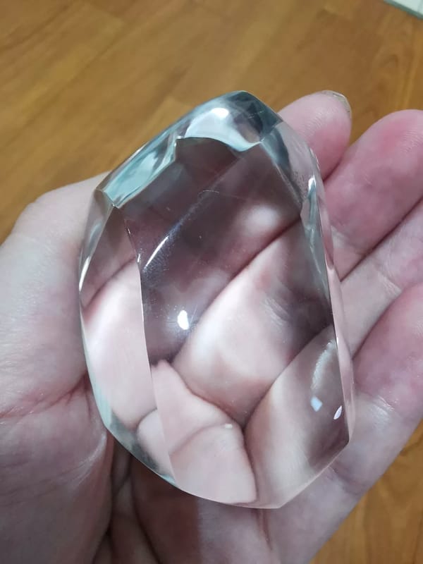 Complete low angled view of the same polished clear quartz freeform