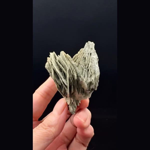 Layered grey-green bladed calcite from Inner Mongolia — alternate view