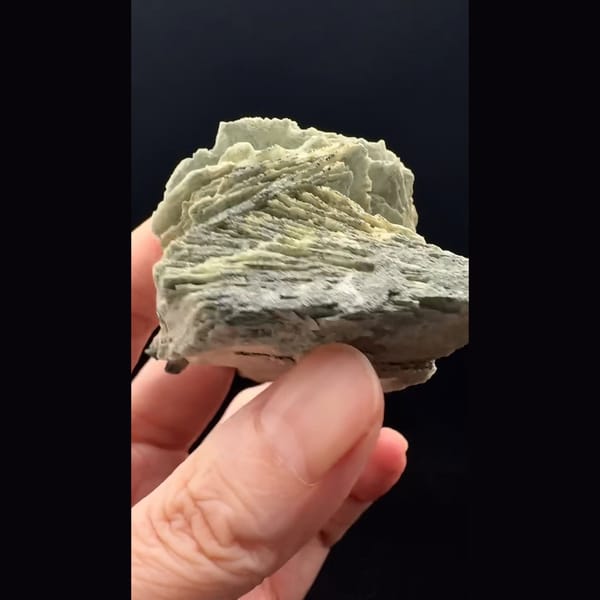 Layered grey-green bladed calcite from Inner Mongolia — alternate view