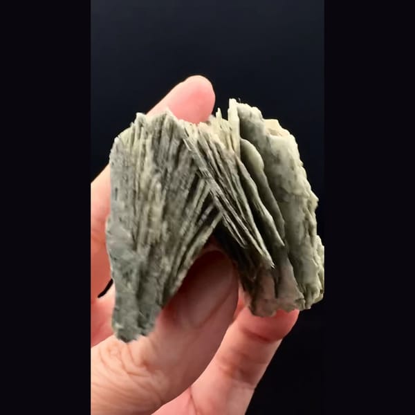 Layered grey-green bladed calcite from Inner Mongolia — detail view