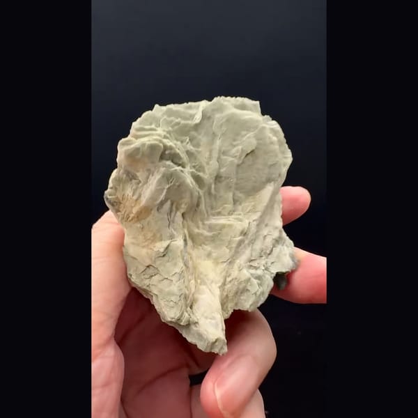 Layered grey-green bladed calcite from Inner Mongolia — detail view
