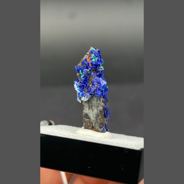 Deep blue azurite with malachite on limonite-coated quartz from Morocco — alternate view