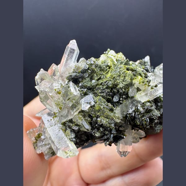 Clear quartz points with dark green epidote — complete view