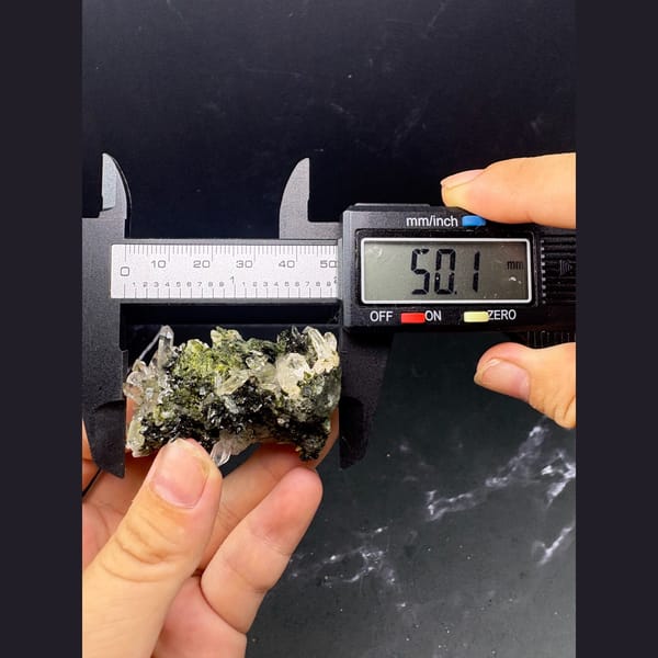 Clear quartz points with dark green epidote — detail view