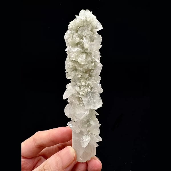 Tall quartz crystal with white bud and petal calcite from Inner Mongolia — complete view