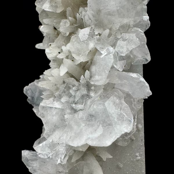 Tall quartz crystal with white bud and petal calcite from Inner Mongolia — detail view