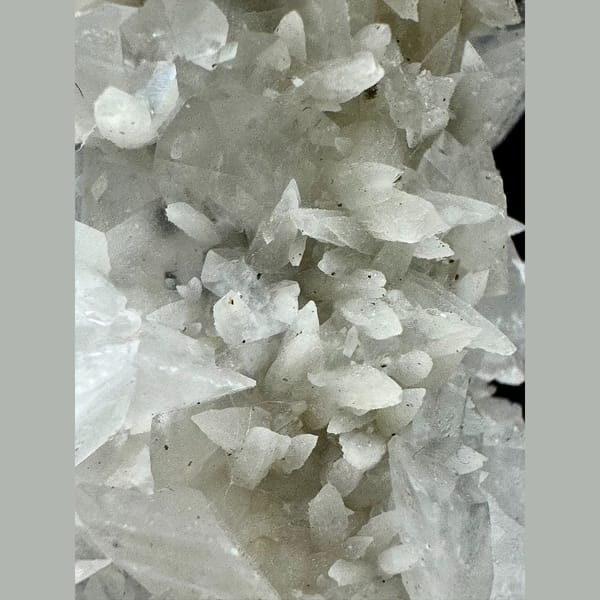 Tall quartz crystal with white bud and petal calcite from Inner Mongolia — detail view