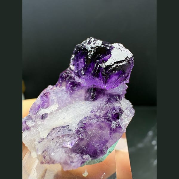 Small deep purple fluorite crystal on white quartz from Luoyang — complete view