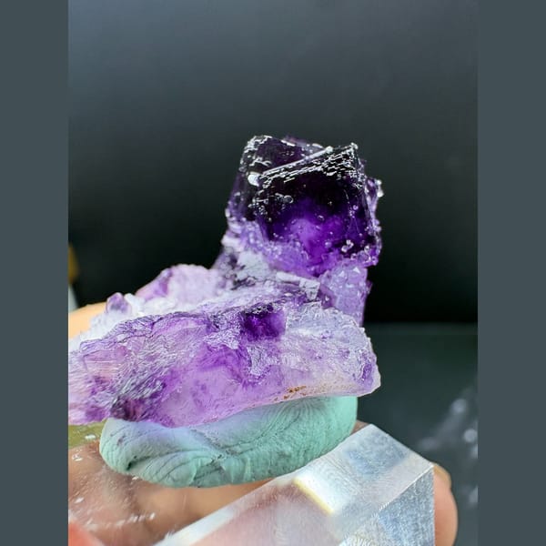 Small deep purple fluorite crystal on white quartz from Luoyang — alternate view
